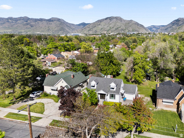 658 North 100 East Logan, UT 84321 - Photo 21 of 26 Established neighborhood setting with mature trees and mountain backdrop
