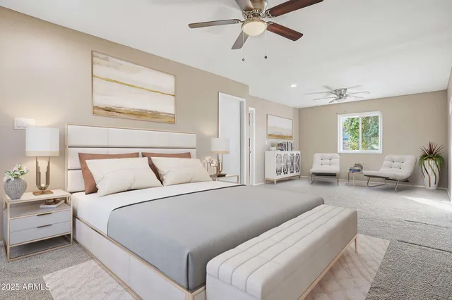 a bedroom with a large bed and furniture