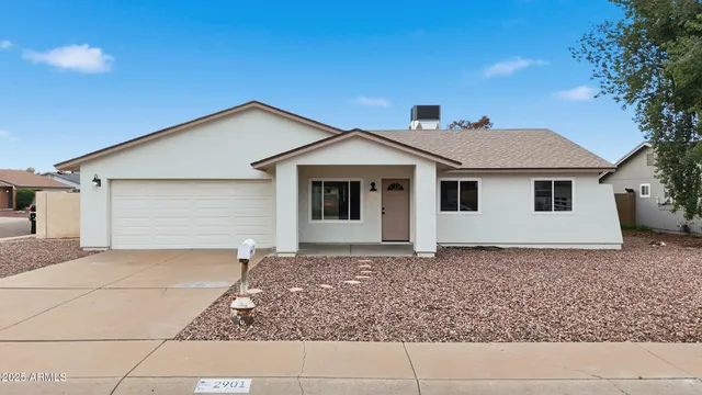 a house with trees in the background