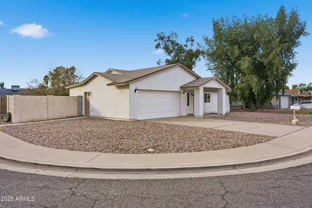 a house with trees in the background