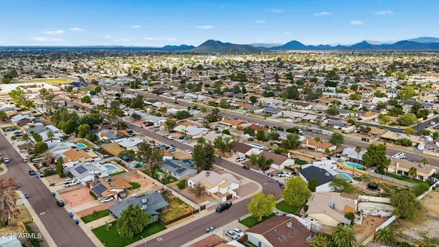 an aerial view of residential building with parking space