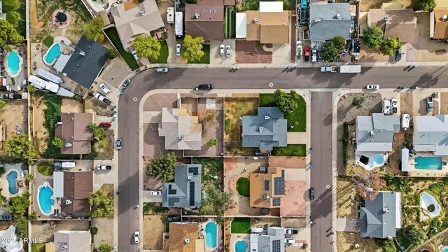 an aerial view of a house with outdoor space