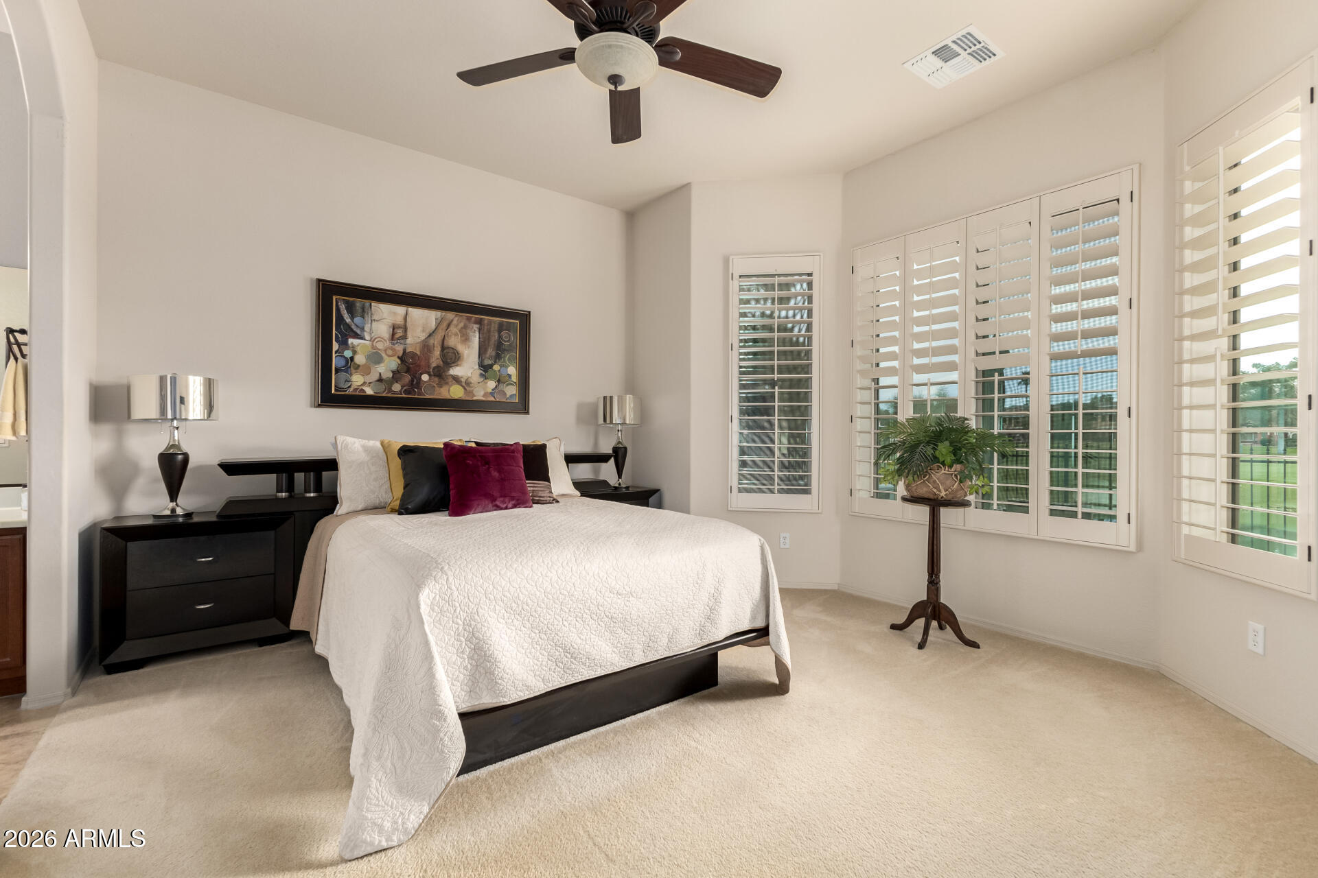 6202 East McKellips Road, Unit 277 Mesa, AZ 85215 - Photo 16 of 55 a bedroom with a bed and a window