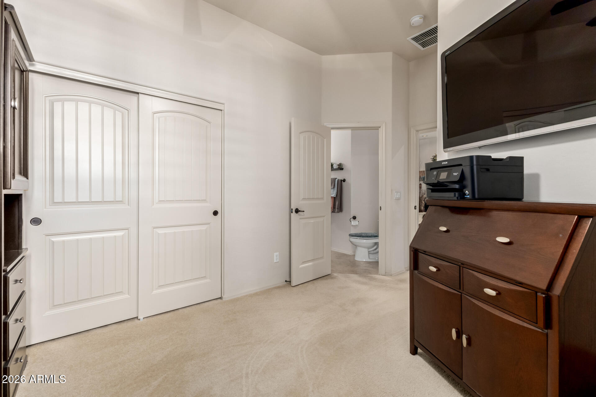 6202 East McKellips Road, Unit 277 Mesa, AZ 85215 - Photo 21 of 55 a room with a tv and a refrigerator