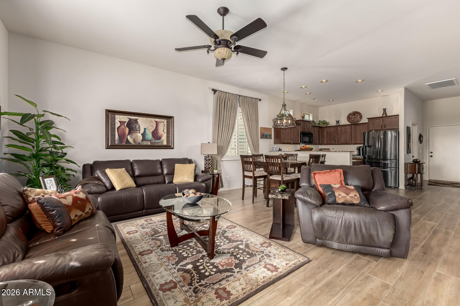 6202 East McKellips Road, Unit 277 Mesa, AZ 85215 - Photo 7 of 55 a living room with furniture and a wooden floor