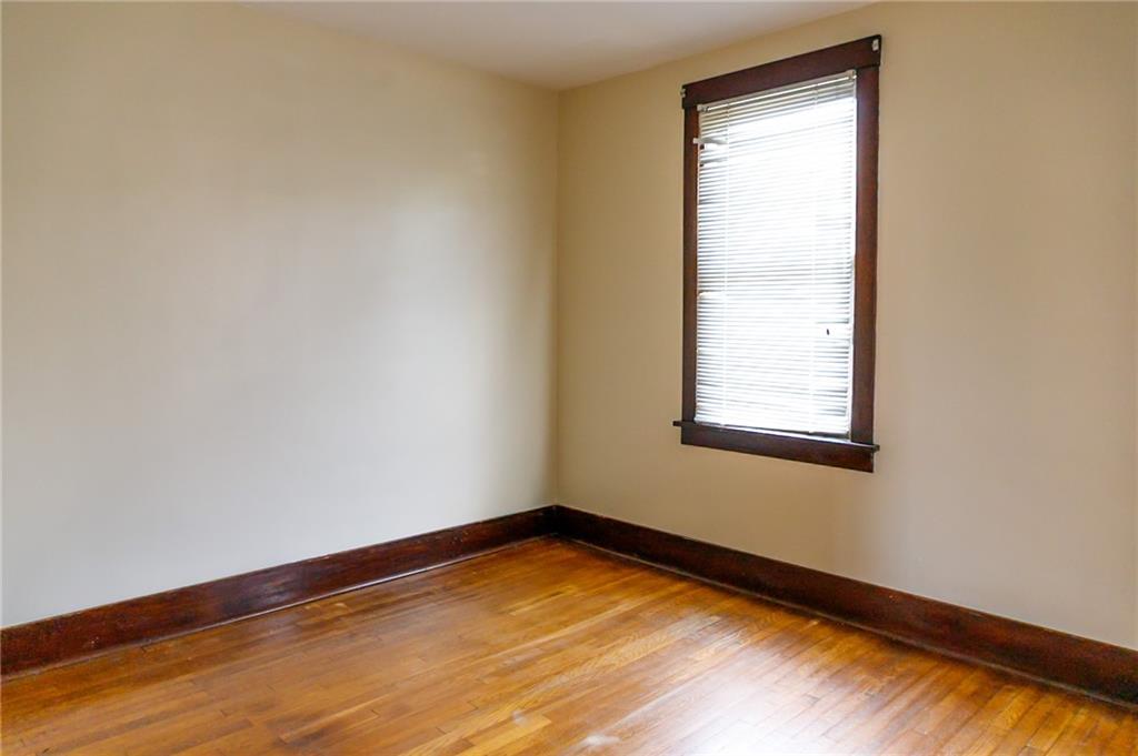 315 Wright Street McKees Rocks, PA 15136 - Photo 26 of 34 a view of a room with wooden floor and a window
