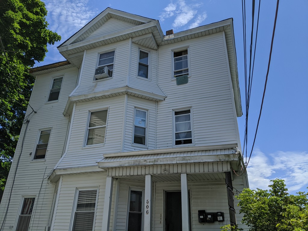 506 4th Street Fall River, MA 02721 - Photo 1 of 8 a front view of a house with a balcony