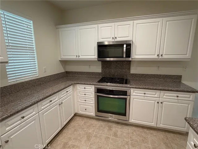 a bathroom with a toilet sink and shower