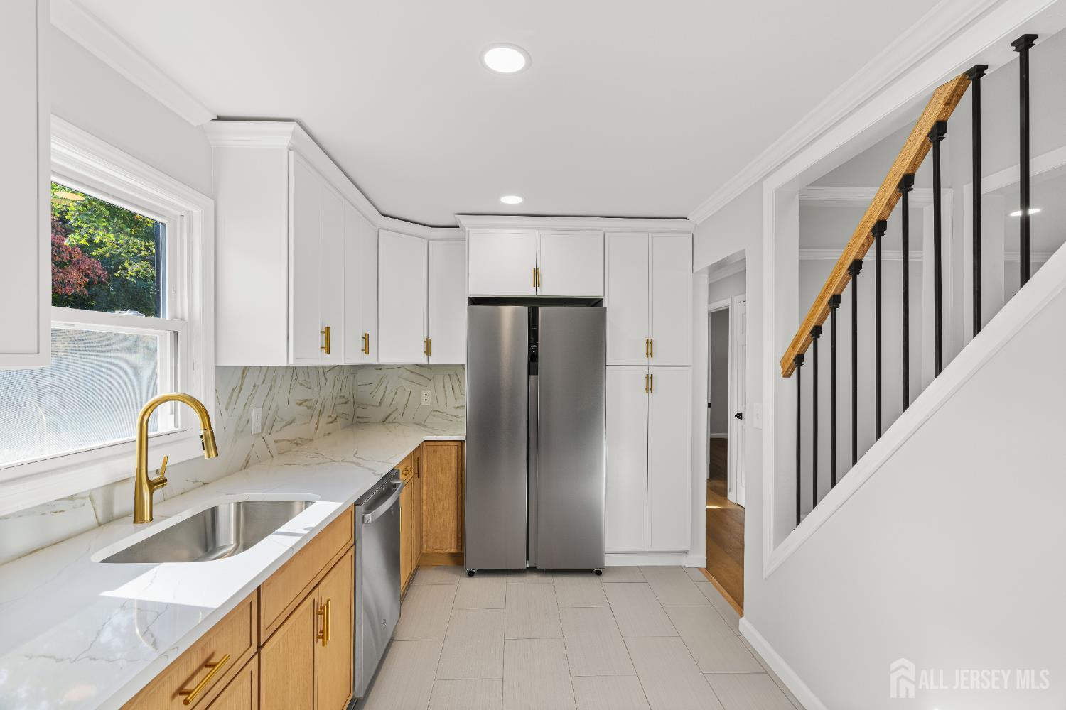 435 Warfield Road North Plainfield, NJ 07063 - Photo 11 of 35 a kitchen with stainless steel appliances granite countertop a refrigerator and a sink