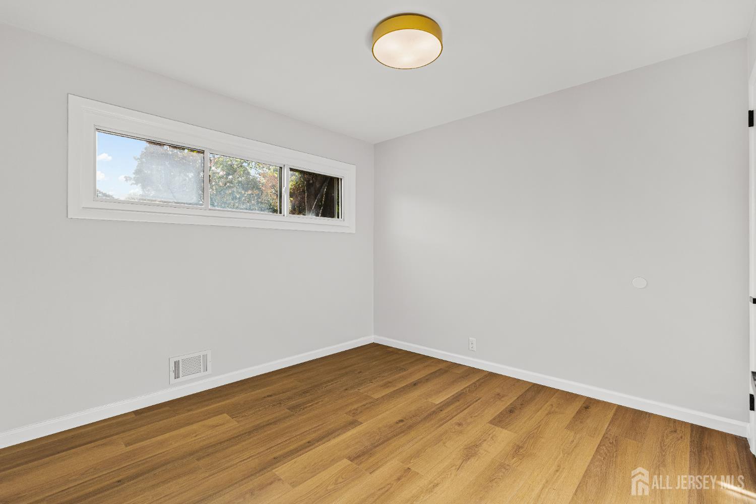 435 Warfield Road North Plainfield, NJ 07063 - Photo 13 of 35 a view of empty room with wooden floor