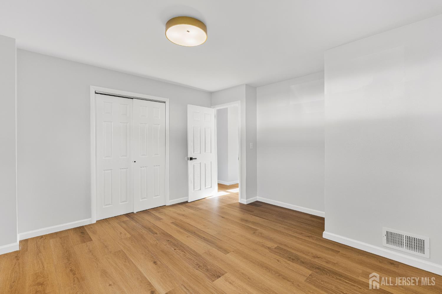 435 Warfield Road North Plainfield, NJ 07063 - Photo 15 of 35 a view of an empty room and wooden floor