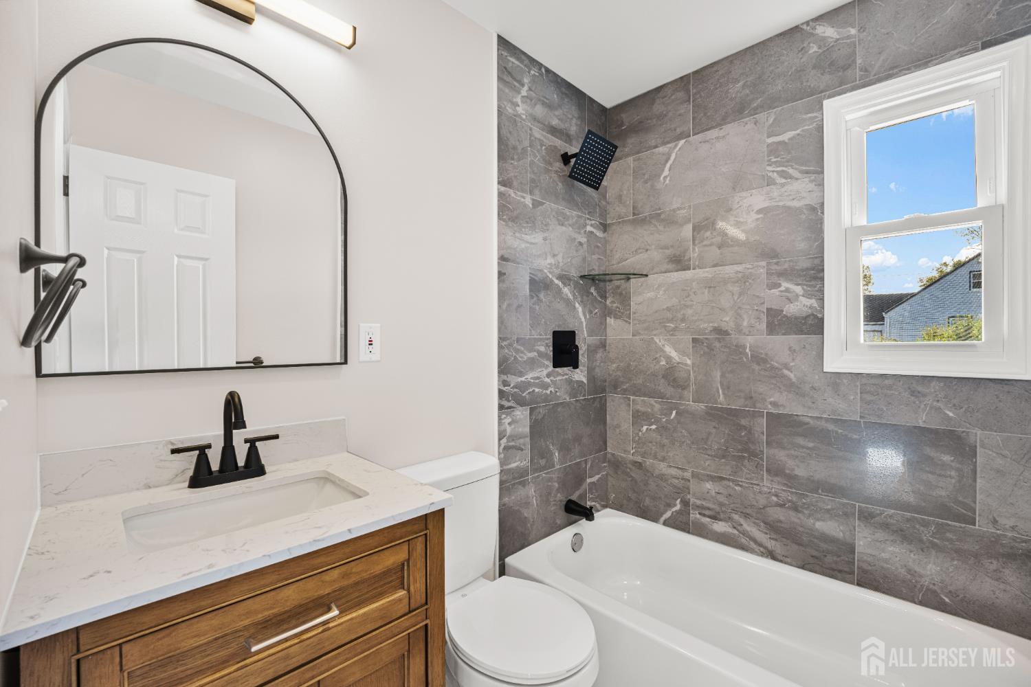 435 Warfield Road North Plainfield, NJ 07063 - Photo 17 of 35 a bathroom with a sink a toilet and shower