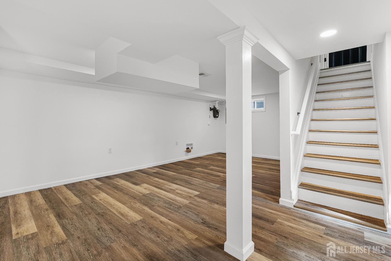 435 Warfield Road North Plainfield, NJ 07063 - Photo 26 of 35 a view of a livingroom with wooden floor and staircase