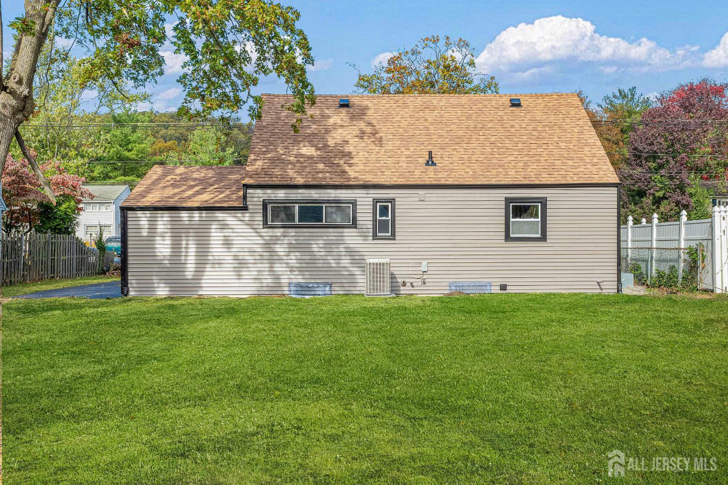 435 Warfield Road North Plainfield, NJ 07063 - Photo 32 of 35 a front view of house with yard and trees in the background