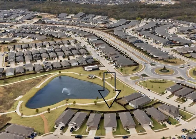 a view of a swimming pool with lawn chairs