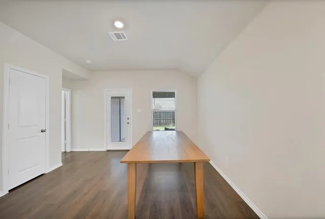 a view of gallery with wooden floor