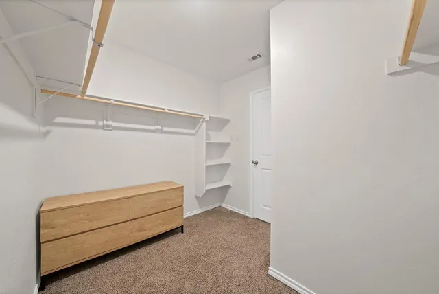 a room with a bed and a window