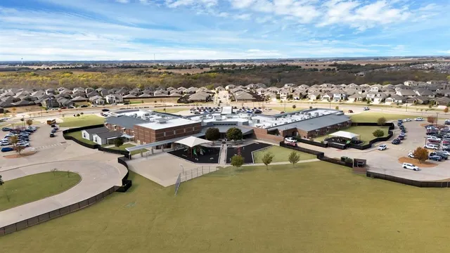 an aerial view of a house with a ocean view