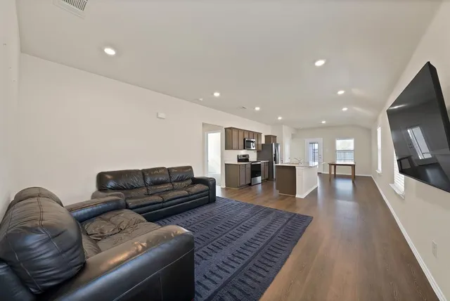 a living room with furniture and a couch