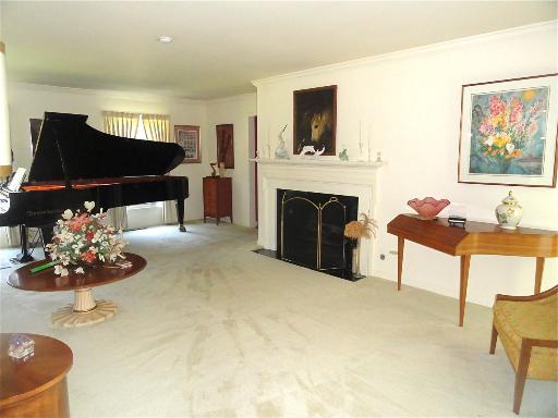 1751 Firth Road Inverness, IL 60067 - Photo 3 of 9 a living room with furniture and a fireplace