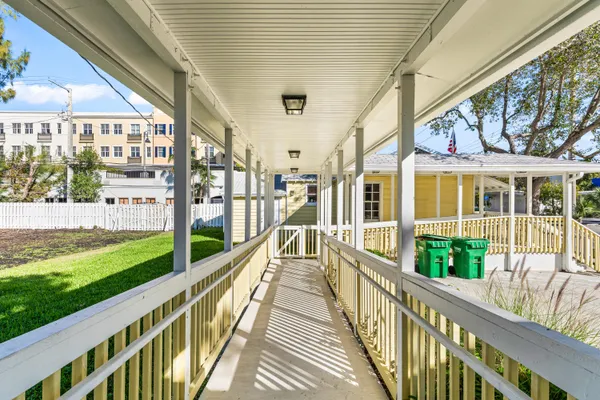 a front view of a house with a yard table and chairs