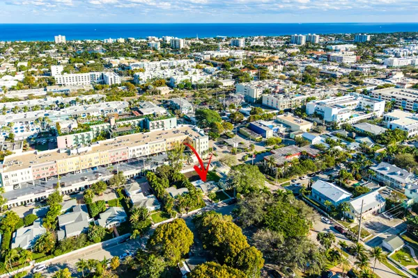 an aerial view of residential houses with outdoor space