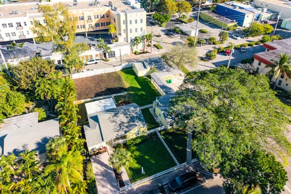 an aerial view of residential houses with outdoor space
