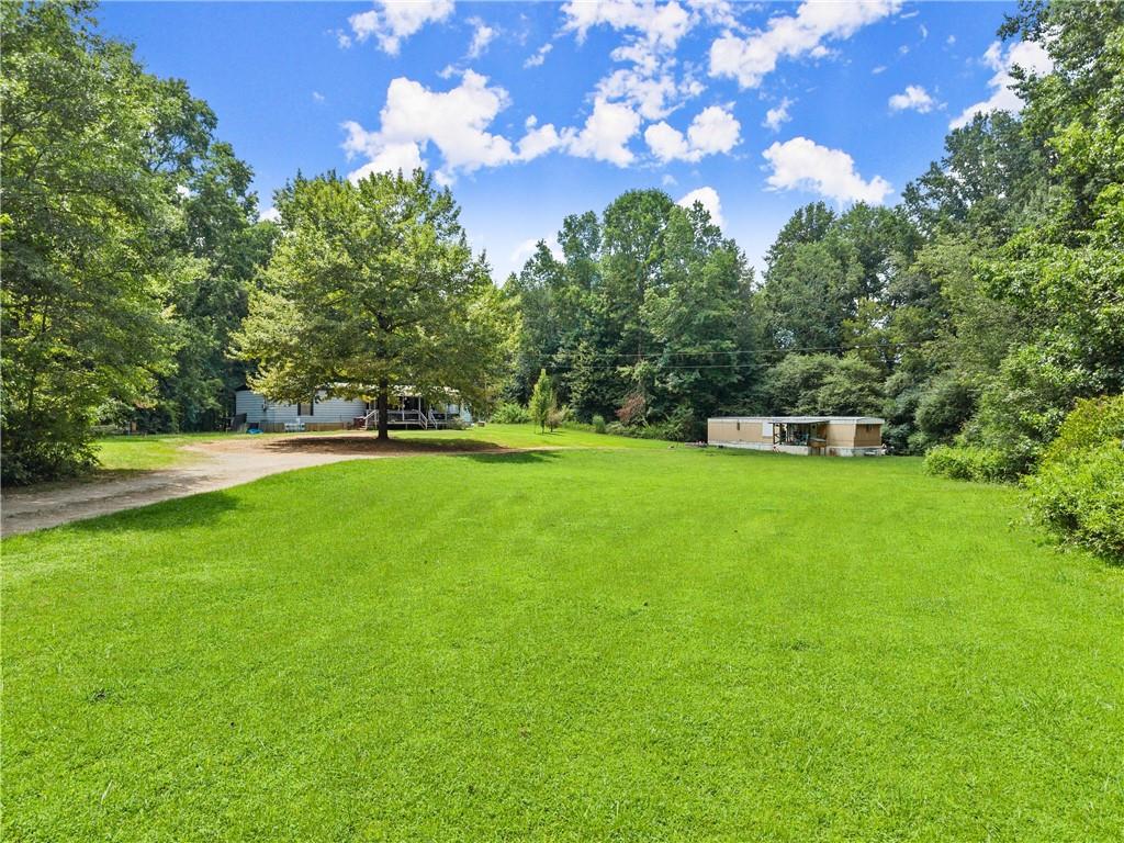 8285 Campground Road Clermont, GA 30527 - Photo 11 of 32 a view of a house with a big yard