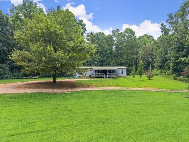 a view of a house with a big yard