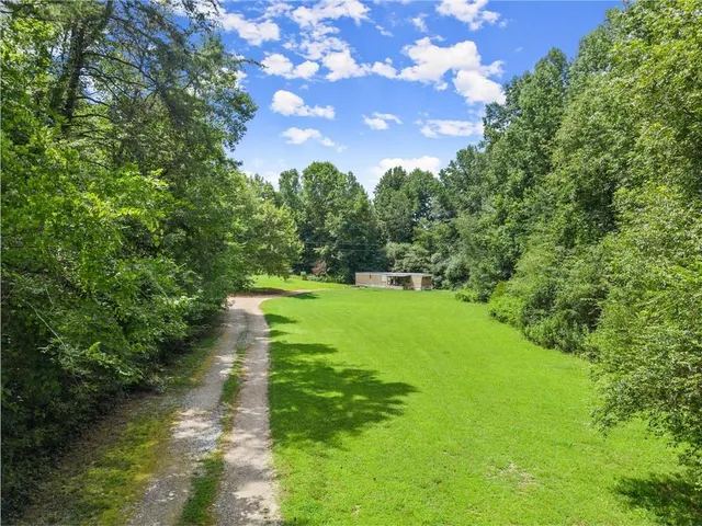 a view of a lake with a yard