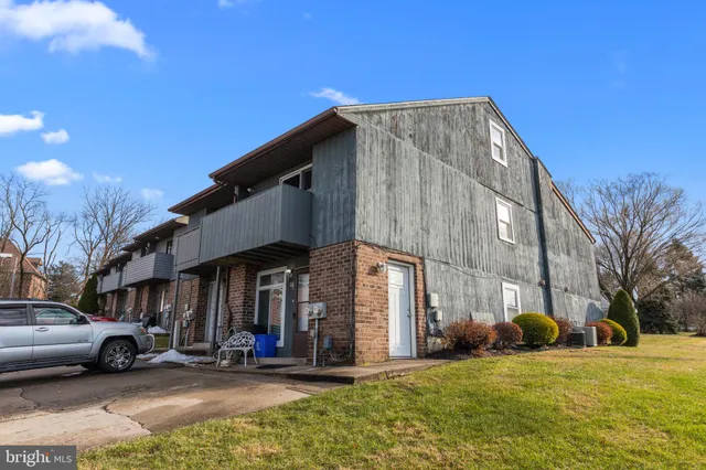 a outdoor space with a couch and chairs