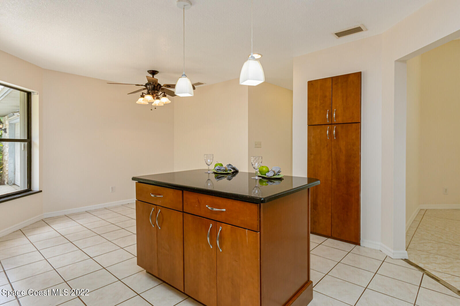 4650 Corey Road Grant Valkaria, FL 32950 - Photo 15 of 56 a view of kitchen with cabinets and wooden floor