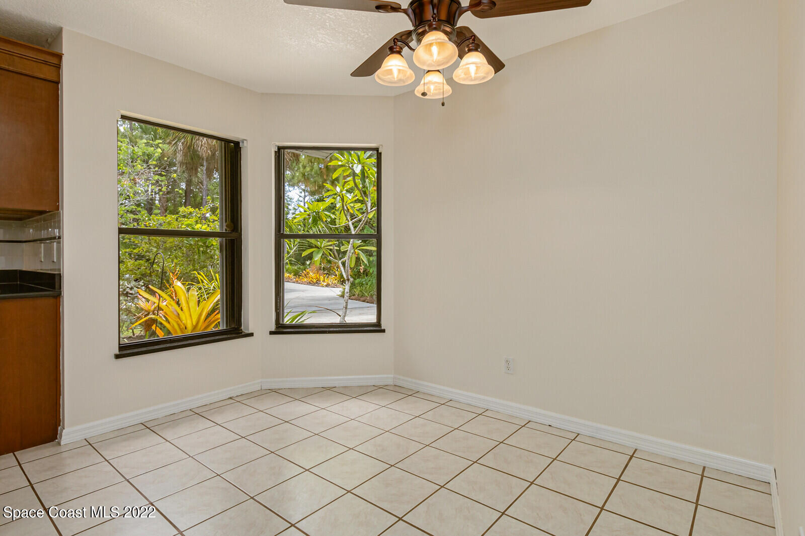 4650 Corey Road Grant Valkaria, FL 32950 - Photo 16 of 56 an empty room with windows