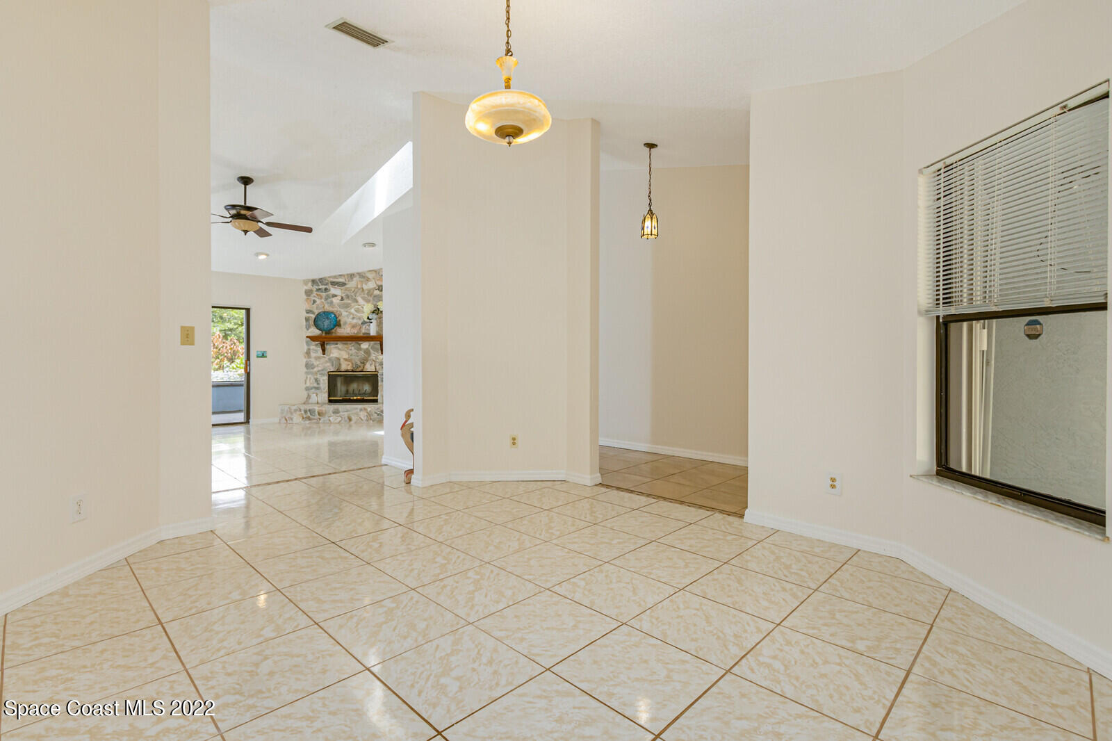 4650 Corey Road Grant Valkaria, FL 32950 - Photo 18 of 56 an empty room with cabinet and mirrors