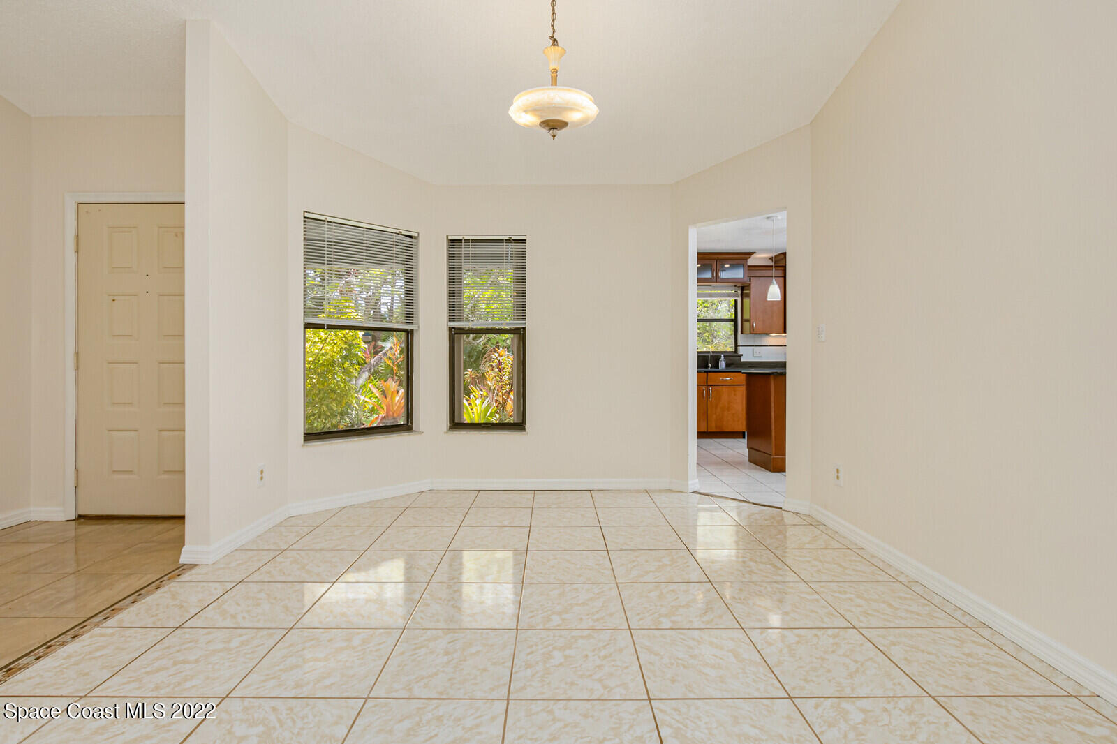 4650 Corey Road Grant Valkaria, FL 32950 - Photo 19 of 56 a view of an empty room with window and cabinet