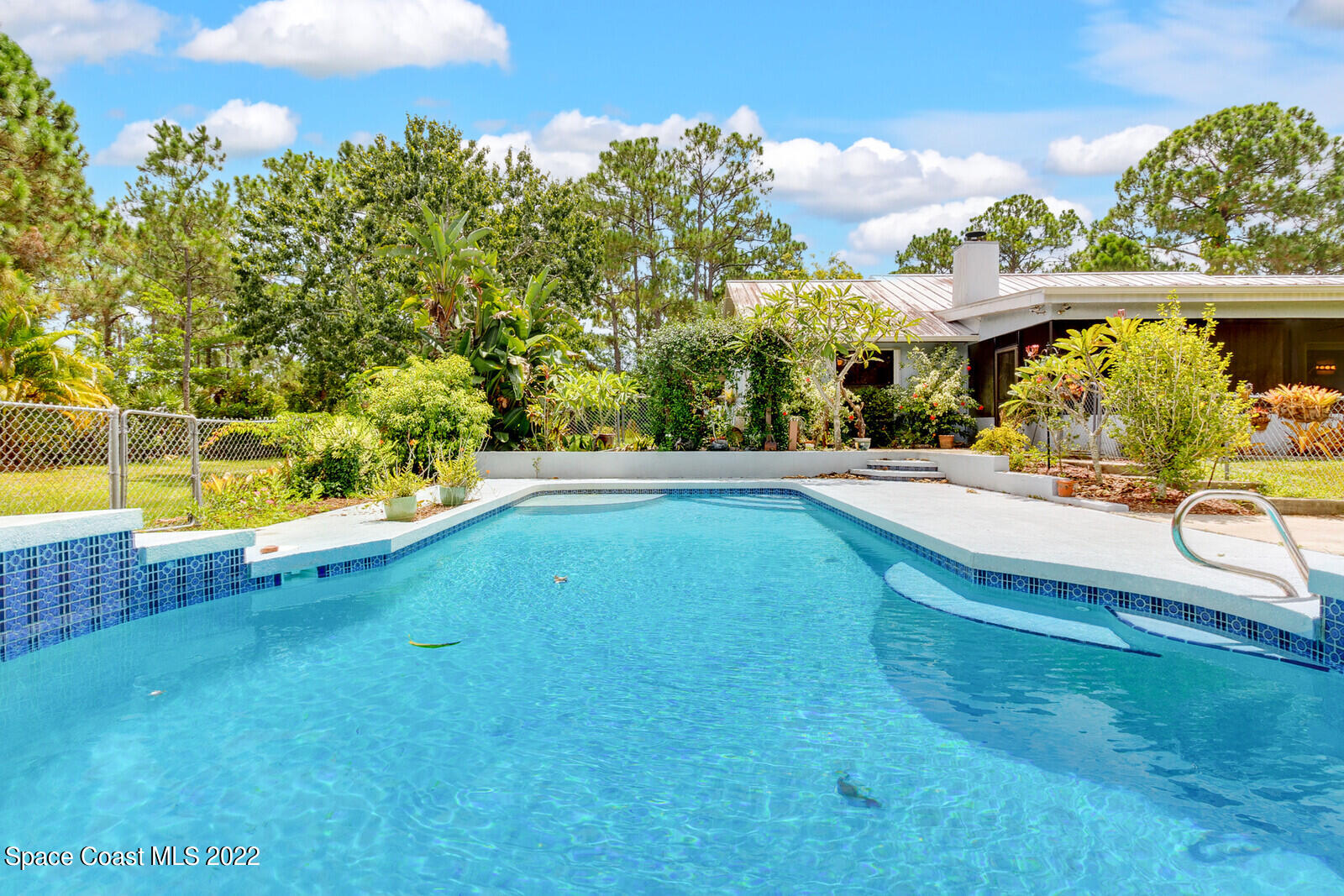 4650 Corey Road Grant Valkaria, FL 32950 - Photo 2 of 56 swimming pool view with a outdoor seating