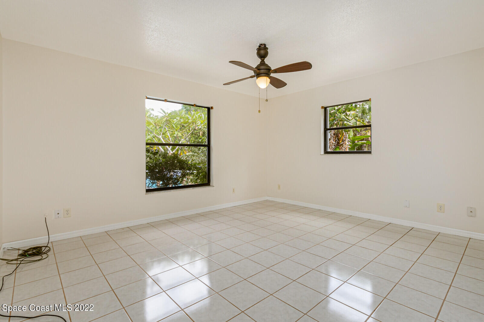 4650 Corey Road Grant Valkaria, FL 32950 - Photo 28 of 56 a view of room with window and ceiling fan
