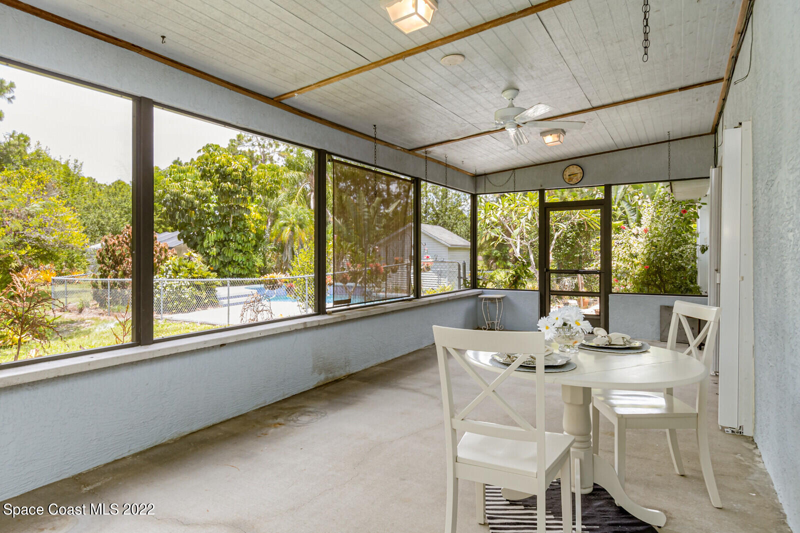 4650 Corey Road Grant Valkaria, FL 32950 - Photo 3 of 56 a dining room with stainless steel appliances granite countertop furniture and a large window