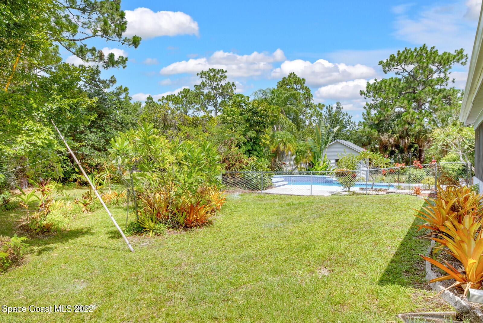 4650 Corey Road Grant Valkaria, FL 32950 - Photo 36 of 56 a view of swimming pool from a yard
