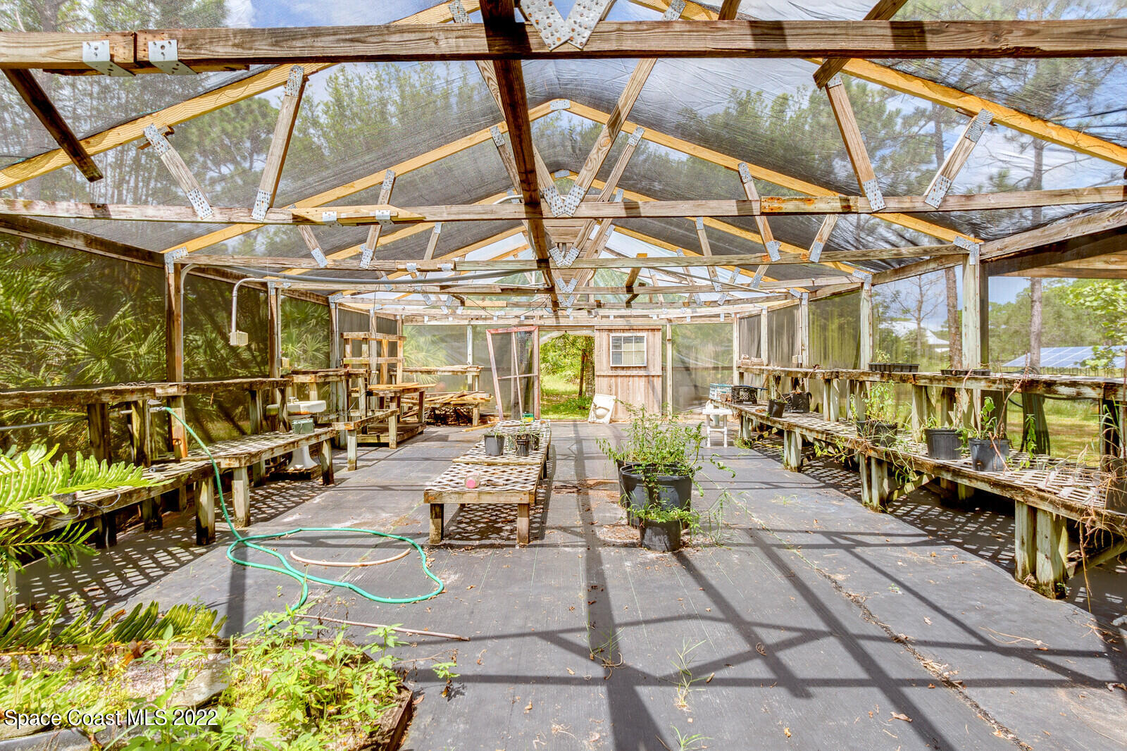 4650 Corey Road Grant Valkaria, FL 32950 - Photo 41 of 56 a view of a swimming pool with a patio