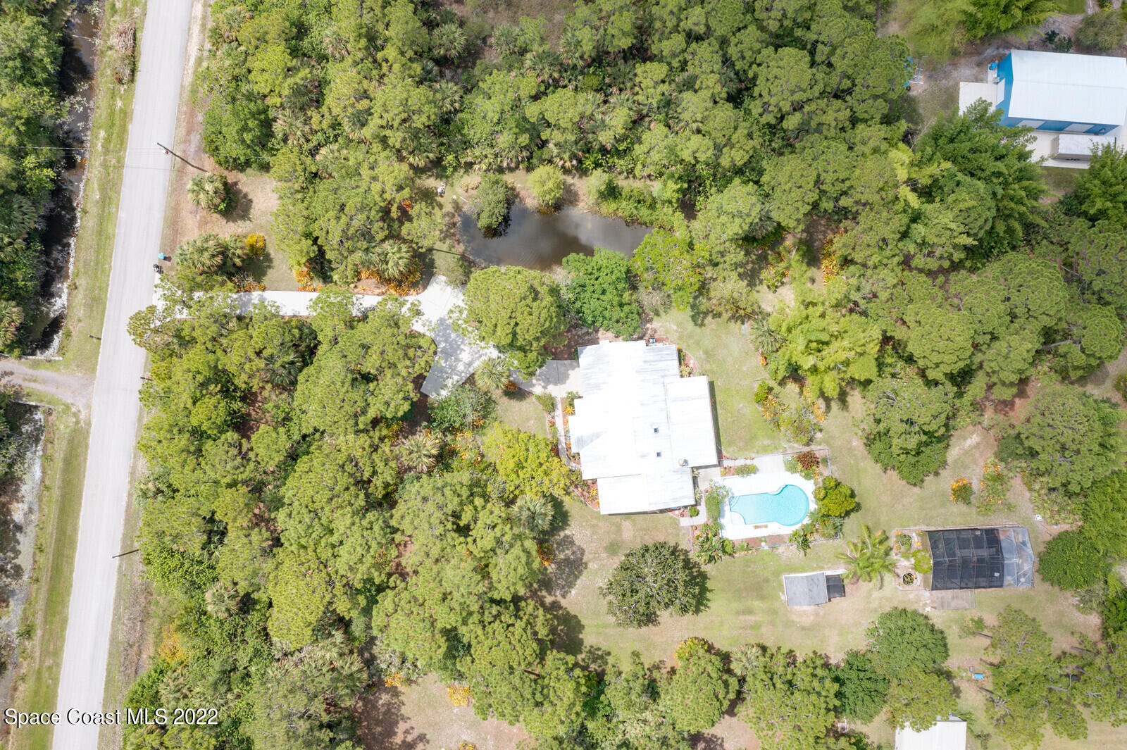 4650 Corey Road Grant Valkaria, FL 32950 - Photo 54 of 56 a view of a house with a yard