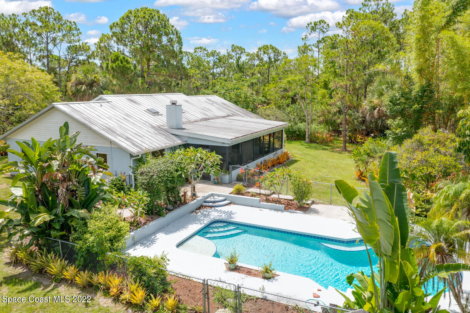 4650 Corey Road Grant Valkaria, FL 32950 - Photo 55 of 56 an aerial view of a house with a yard basket ball court and outdoor seating