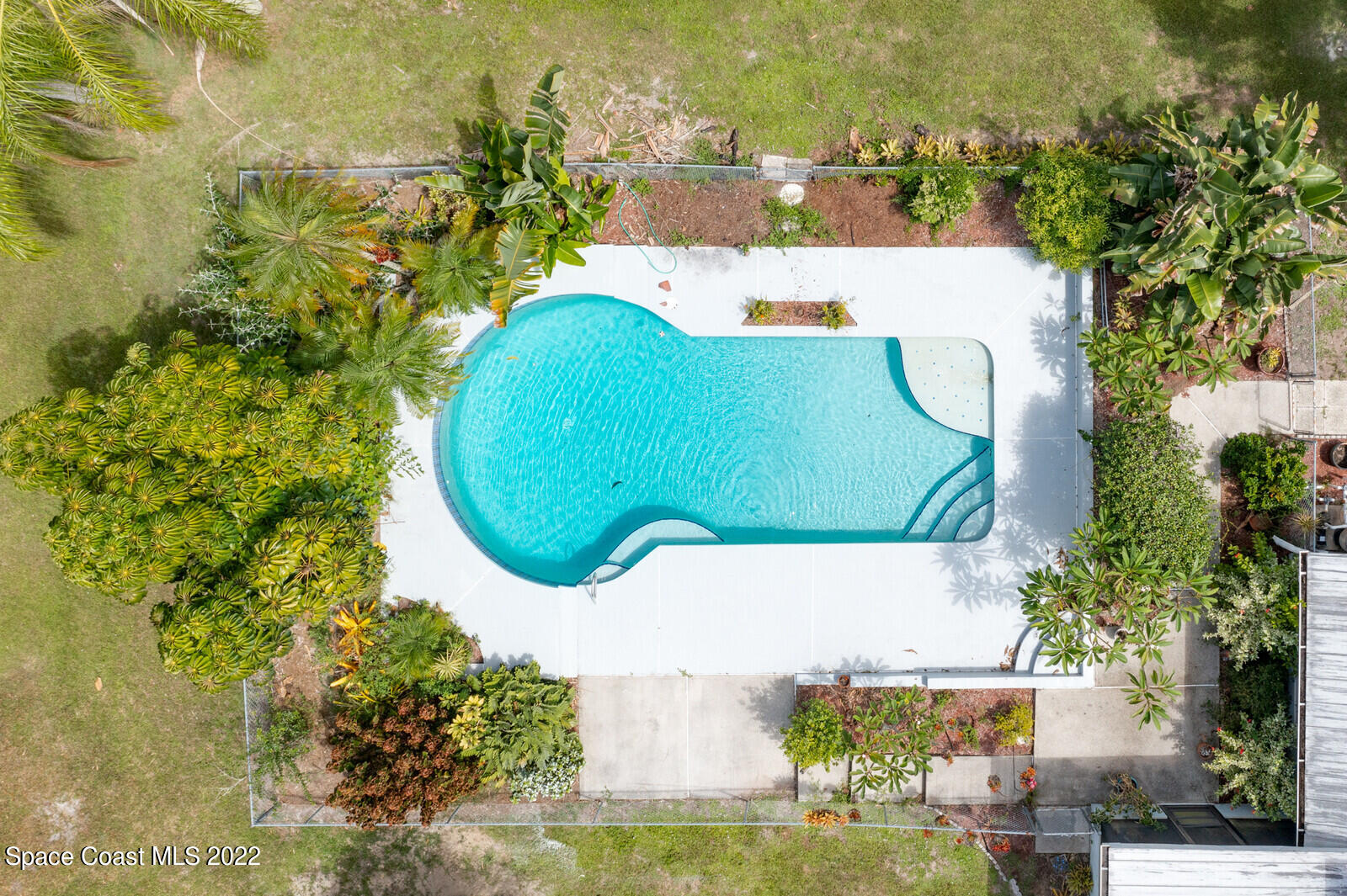 4650 Corey Road Grant Valkaria, FL 32950 - Photo 56 of 56 an aerial view of a swimming pool