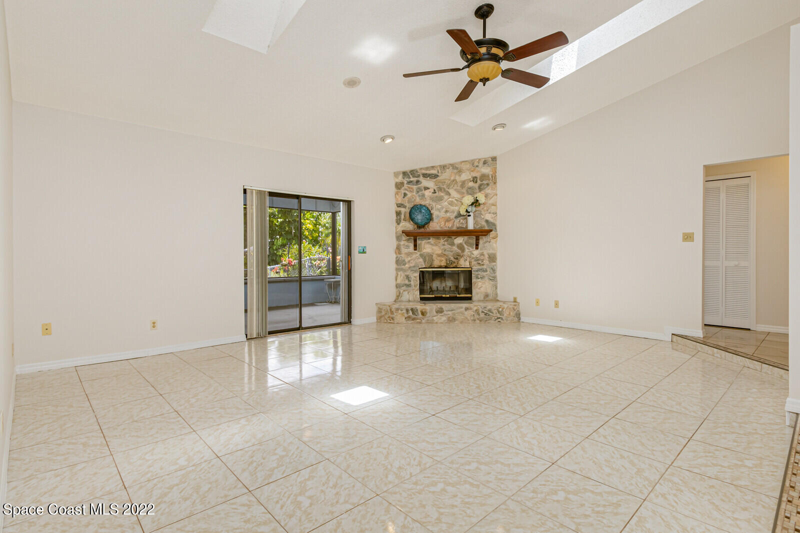 4650 Corey Road Grant Valkaria, FL 32950 - Photo 8 of 56 an empty room with windows and fan