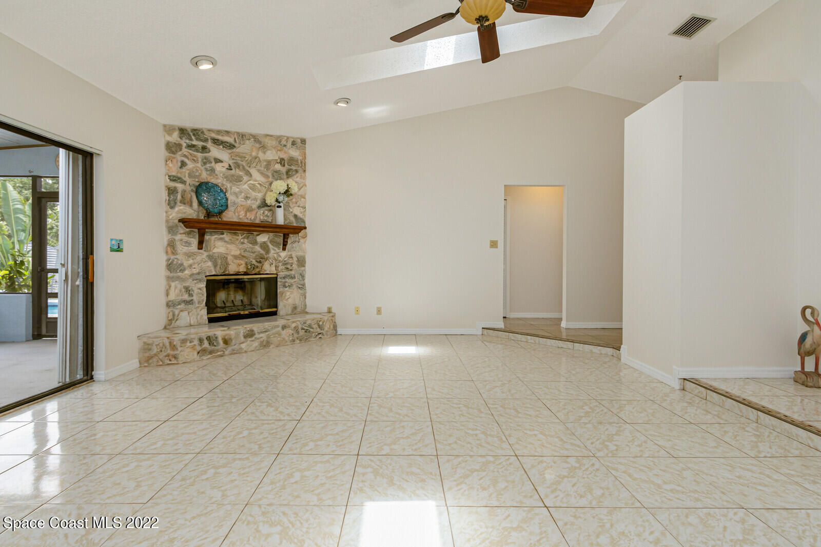 4650 Corey Road Grant Valkaria, FL 32950 - Photo 9 of 56 a view of an empty room with a fireplace