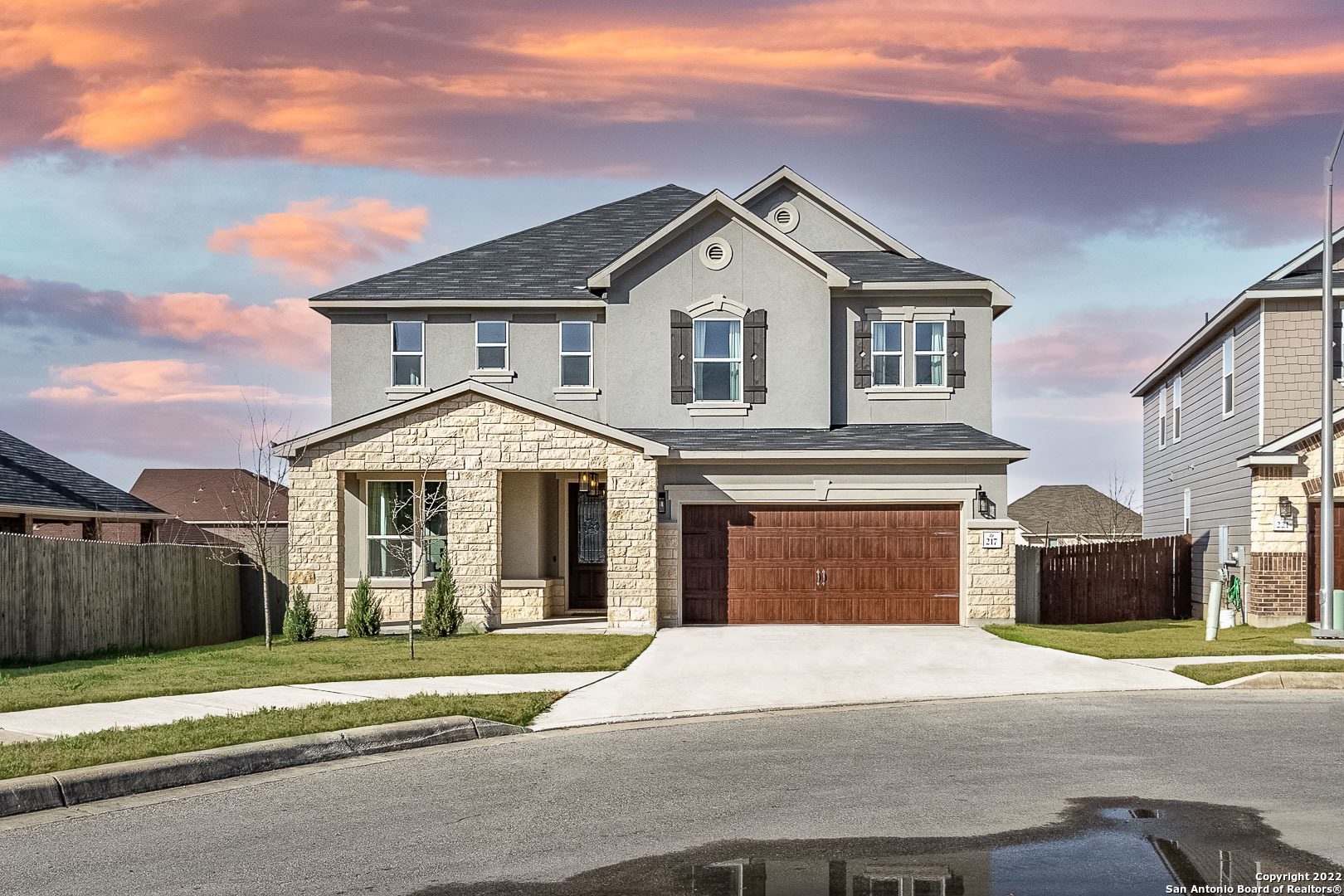 a front view of a house with a yard