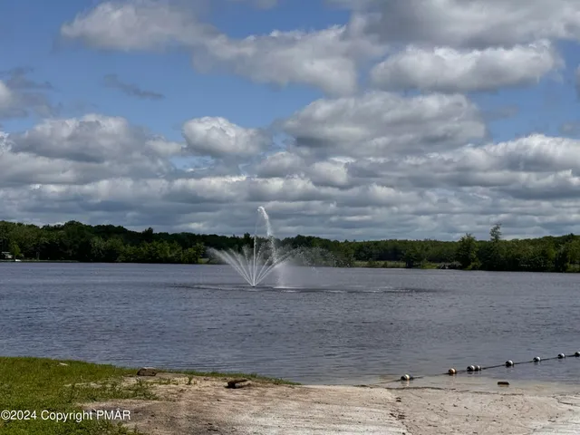 a view of lake with mountain in background