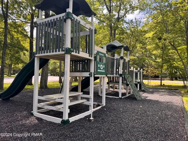 a view of a chair and tables in the patio