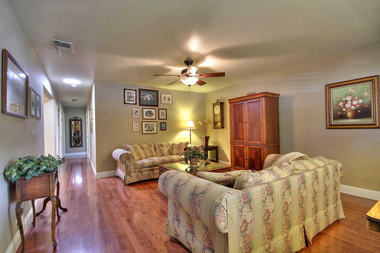 3953 Bucknall Road Campbell, CA 95008 - Photo 14 of 30 a bedroom with furniture a chandelier and wooden floor