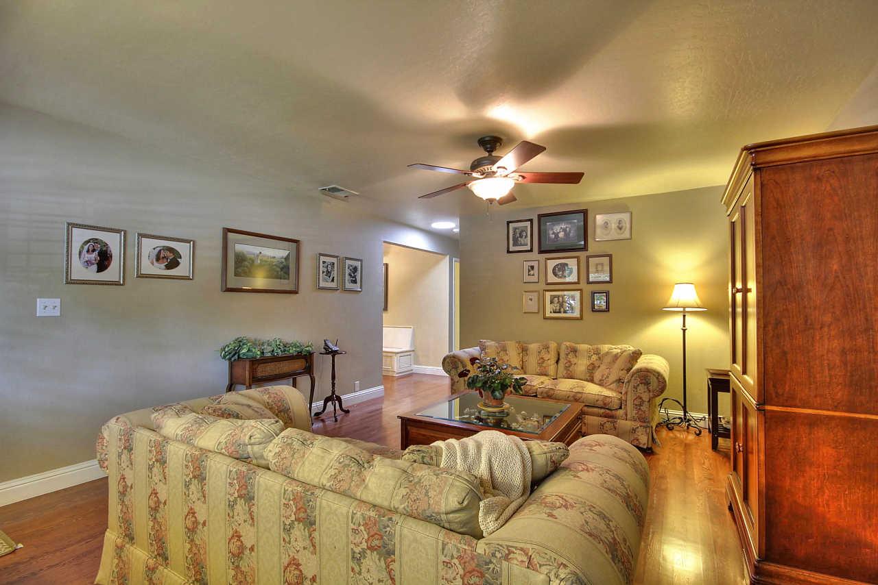 3953 Bucknall Road Campbell, CA 95008 - Photo 17 of 30 a bed room with a bed and a chandelier